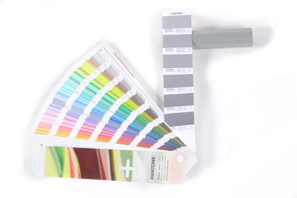 Cool Gray 7 U. Showing the sample tube and the swatch in the Pantone book.